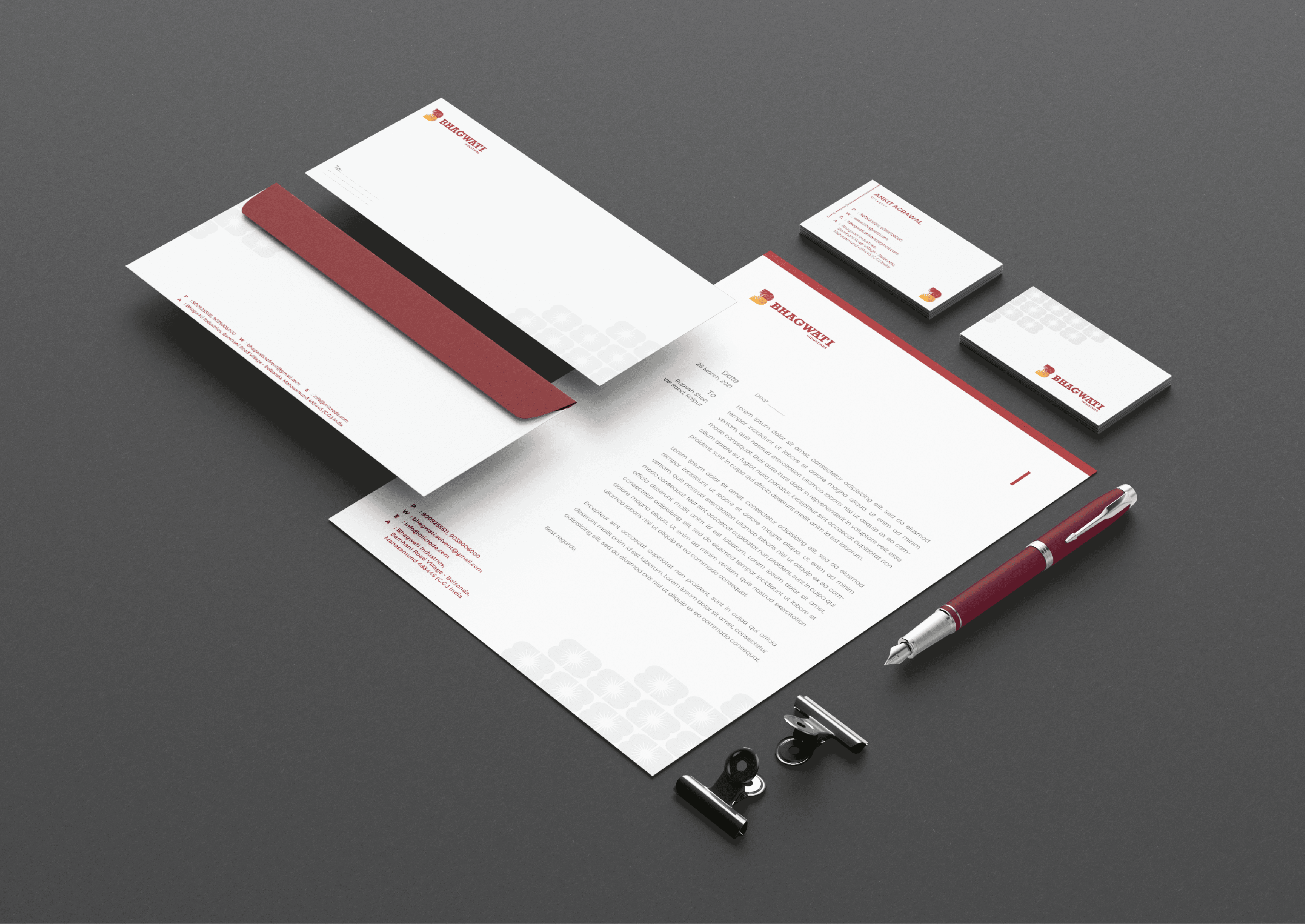 Stationery suite — letterhead, envelope, and business cards with maroon accent stripe
