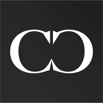 Reversed monogram — white 'CD' mark on dark charcoal background